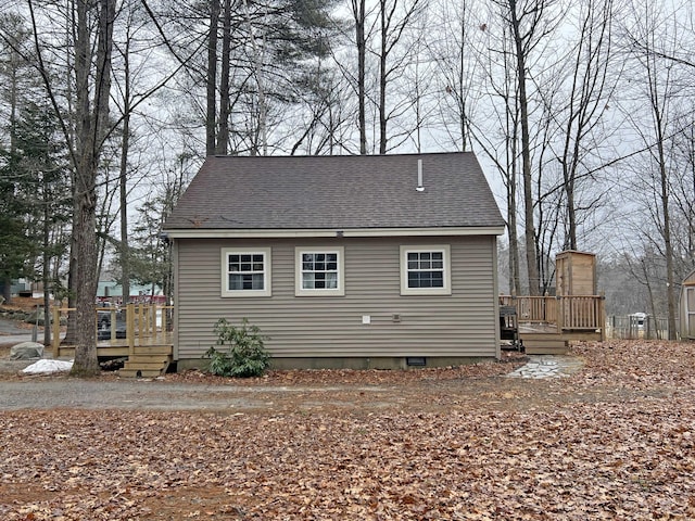 25 Garland Rd, Casco, ME 04015 - view of side of property featuring roof with shingles and a wooden deck