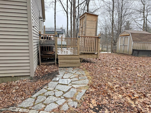 25 Garland Rd, Casco, ME 04015 - view of yard with a wooden deck, an outdoor structure, and a shed