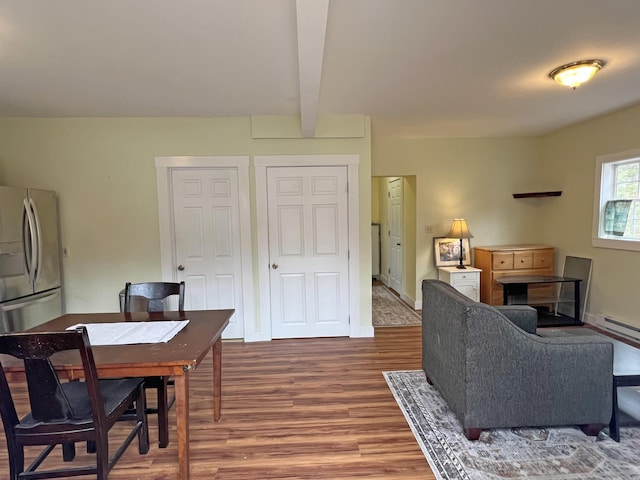 25 Garland Rd, Casco, ME 04015 - living room featuring beamed ceiling, baseboards, and wood finished floors