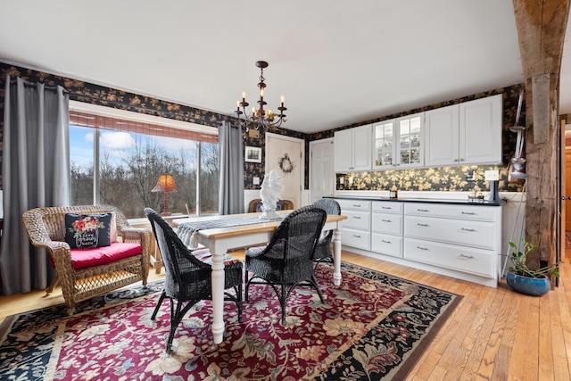 663 Eastbrook Rd, Eastbrook, ME 04634 - dining room featuring a chandelier and light wood finished floors