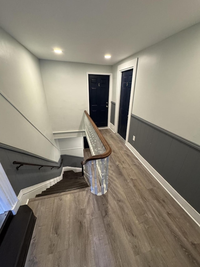 64 Gray St, Portland, ME 04102 - stairs featuring wood finished floors, a wainscoted wall, recessed lighting, and baseboards