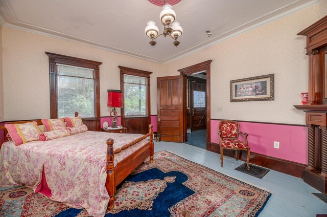 1135 E Pittston Rd, Pittston, ME 04345 - bedroom featuring a chandelier, baseboards, and ornamental molding