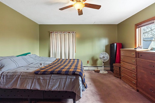 bedroom with a baseboard heating unit, baseboards, carpet floors, and ceiling fan