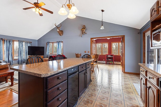 kitchen featuring a kitchen bar, pendant lighting, a ceiling fan, a kitchen island, and dark brown cabinets
