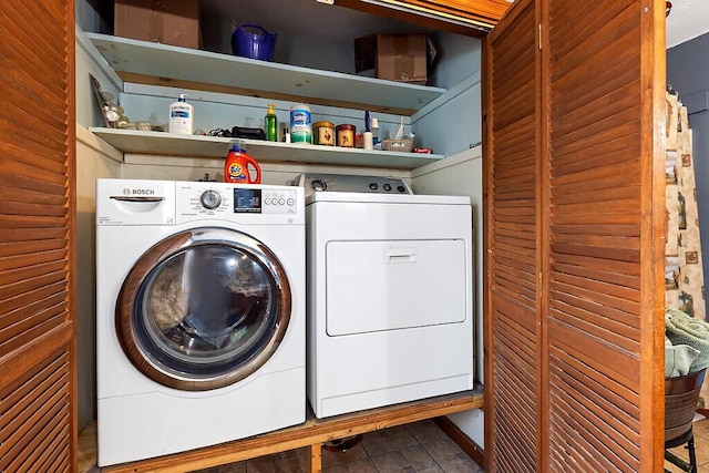 laundry room featuring laundry area and washing machine and dryer