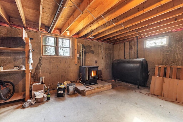 basement with heating fuel and a wood stove