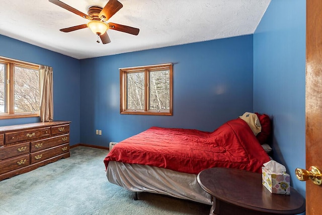 bedroom with multiple windows, carpet floors, baseboards, and ceiling fan