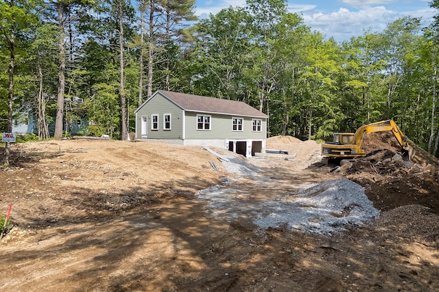 0 Clearview Ln, Limerick, ME 04048 - back of house featuring an attached garage, dirt driveway, and a forest view