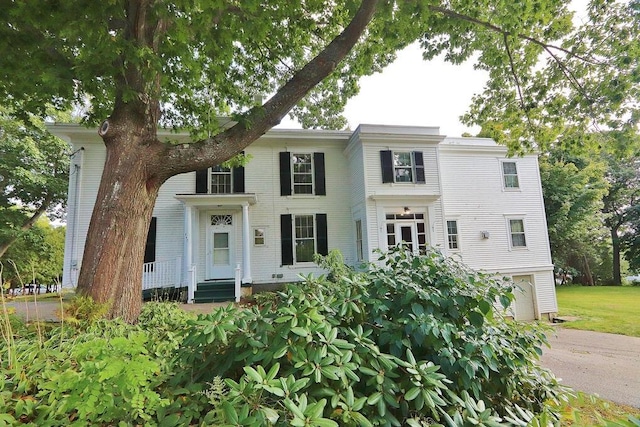 view of front of home featuring driveway and a garage