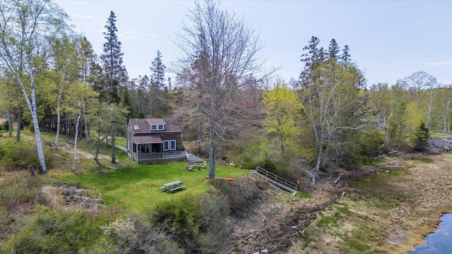 138 Hewes Point Rd, Islesboro, ME 04848 - view of green lawn featuring a forest view