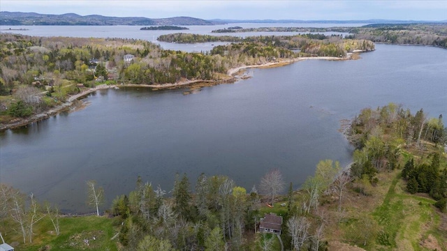 138 Hewes Point Rd, Islesboro, ME 04848 - aerial overview of property's location featuring a water and mountain view and a heavily wooded area