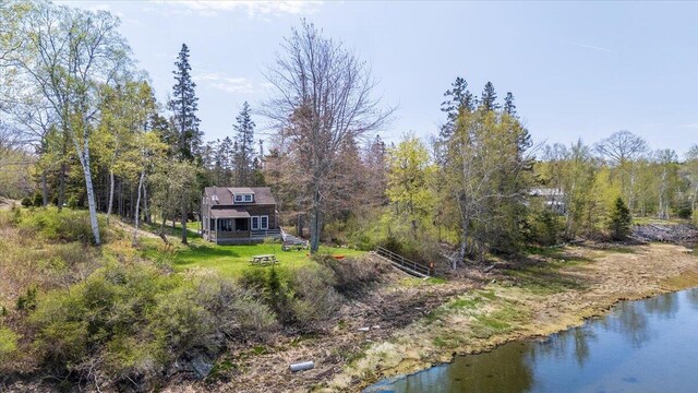 138 Hewes Point Rd, Islesboro, ME 04848 - rear view of property featuring a view of trees
