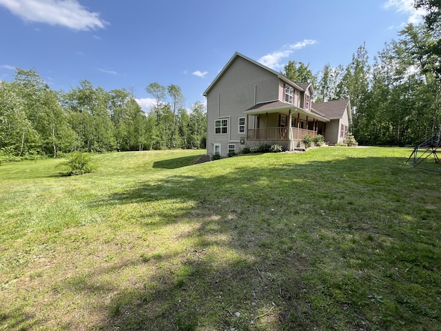 38 Dunston Dr, Glenburn, ME 04401 - view of side of property with a porch and a yard