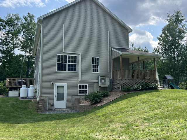 38 Dunston Dr, Glenburn, ME 04401 - back of house with a lawn and a playground
