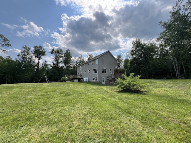 38 Dunston Dr, Glenburn, ME 04401 - view of green lawn featuring a deck