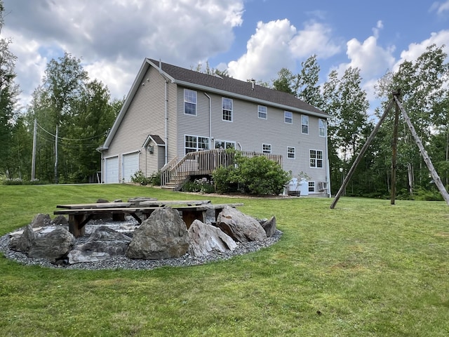 38 Dunston Dr, Glenburn, ME 04401 - back of house with a yard and a deck