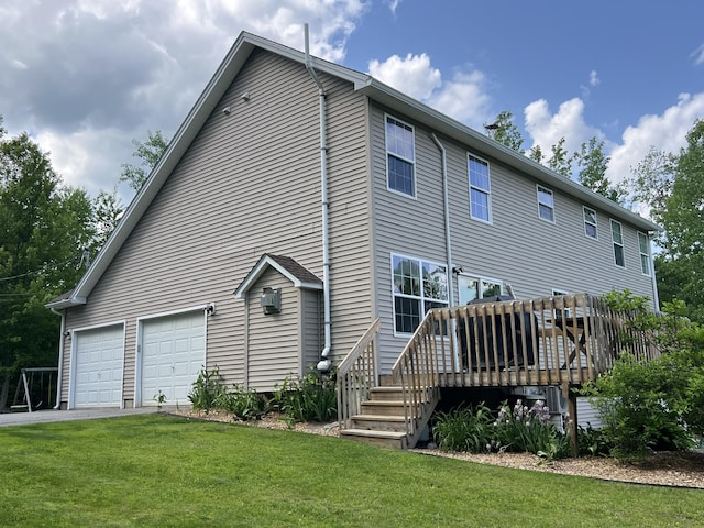 38 Dunston Dr, Glenburn, ME 04401 - back of house with a yard, a wooden deck, and driveway