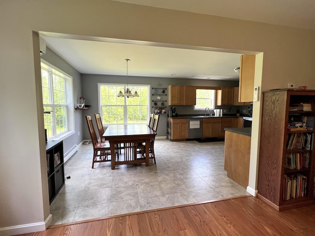 38 Dunston Dr, Glenburn, ME 04401 - dining area with a baseboard radiator and a chandelier