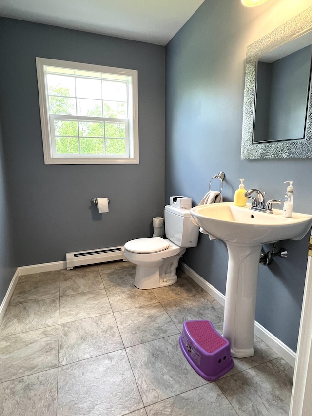 38 Dunston Dr, Glenburn, ME 04401 - bathroom featuring a baseboard heating unit and toilet