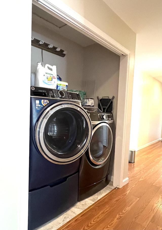 38 Dunston Dr, Glenburn, ME 04401 - laundry area with washing machine and dryer and wood finished floors