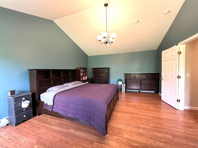 38 Dunston Dr, Glenburn, ME 04401 - bedroom featuring lofted ceiling, a chandelier, and wood finished floors