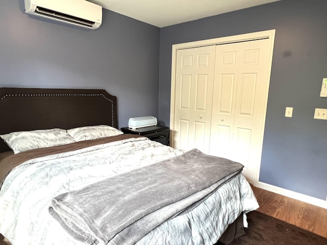 38 Dunston Dr, Glenburn, ME 04401 - bedroom featuring a wall mounted AC, wood finished floors, and a closet