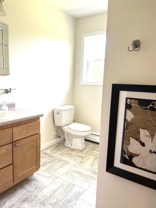 38 Dunston Dr, Glenburn, ME 04401 - bathroom featuring a baseboard radiator and vanity