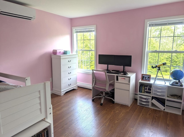 38 Dunston Dr, Glenburn, ME 04401 - bedroom with a wall unit AC, a baseboard radiator, dark wood-type flooring, and an office area