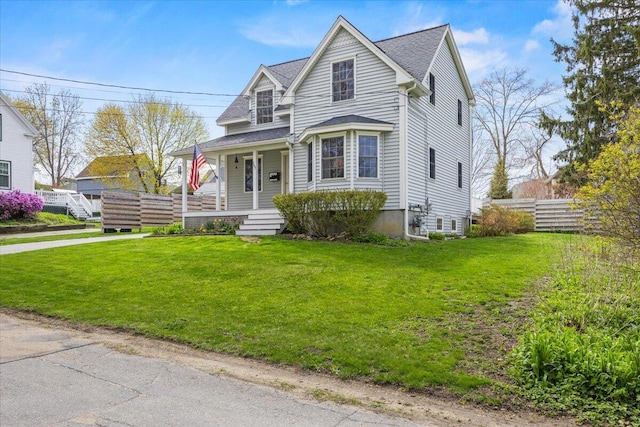 bungalow-style home featuring covered porch and a shingled roof