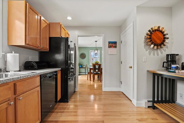 kitchen with black appliances, light wood-type flooring, recessed lighting, brown cabinetry, and baseboards