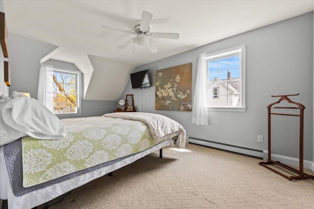 carpeted bedroom with a baseboard radiator and a ceiling fan