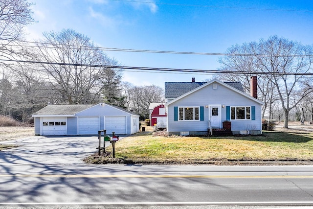 88 Snowball Hill Rd, Bristol, ME 04554 - view of front facade featuring a garage, a front yard, an outbuilding, and a chimney