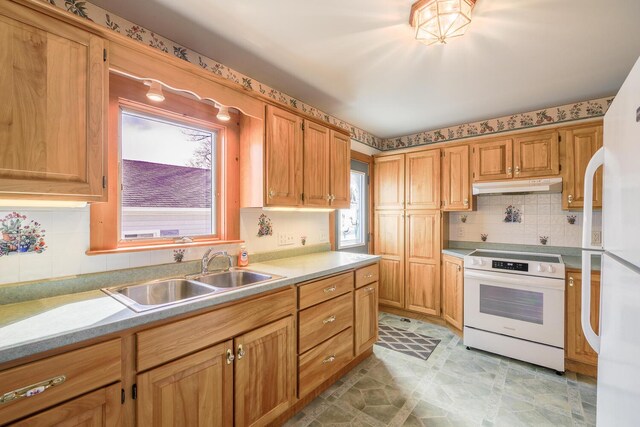 88 Snowball Hill Rd, Bristol, ME 04554 - kitchen featuring white appliances, light countertops, under cabinet range hood, a sink, and backsplash