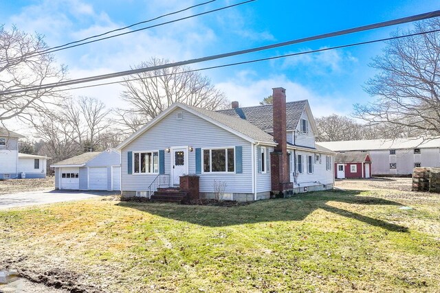88 Snowball Hill Rd, Bristol, ME 04554 - view of front facade featuring a detached garage, a front yard, entry steps, an outbuilding, and a chimney