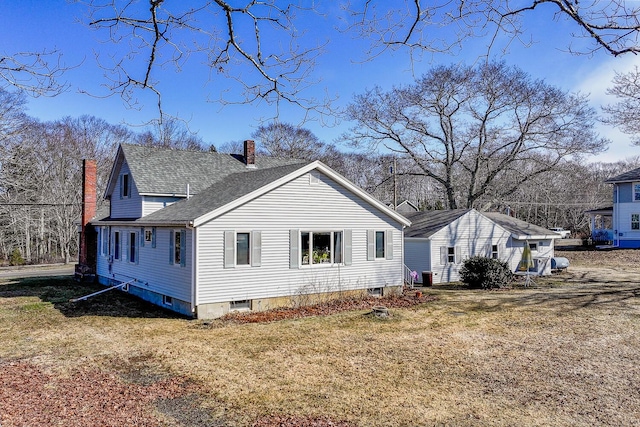 88 Snowball Hill Rd, Bristol, ME 04554 - view of home's exterior with a lawn, central AC, a chimney, and a shingled roof