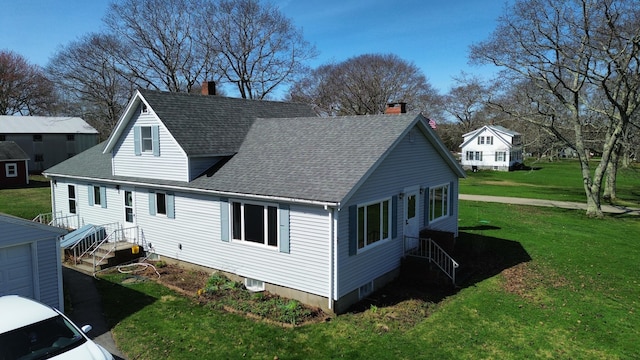88 Snowball Hill Rd, Bristol, ME 04554 - rear view of house with roof with shingles, a chimney, and a lawn