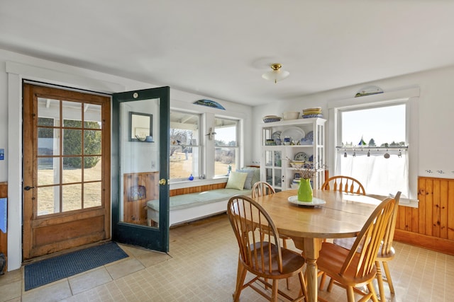 108 N Shore Dr, Owls Head, ME 04854 - dining space featuring a wainscoted wall and wood walls