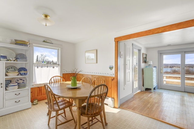 108 N Shore Dr, Owls Head, ME 04854 - dining area with a wealth of natural light, wooden walls, and wainscoting