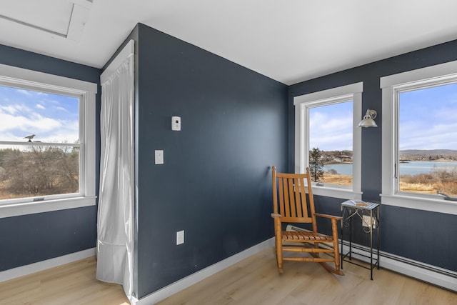 108 N Shore Dr, Owls Head, ME 04854 - living area featuring plenty of natural light, baseboards, and wood finished floors