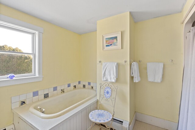 108 N Shore Dr, Owls Head, ME 04854 - bathroom featuring a baseboard radiator and a bath