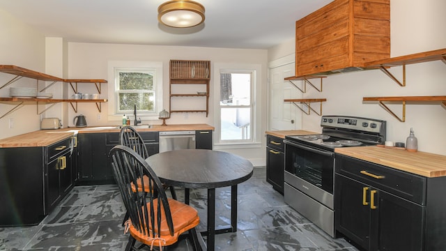 77 Smith St, Fryeburg, ME 04037 - kitchen featuring open shelves, appliances with stainless steel finishes, dark cabinets, butcher block countertops, and a sink