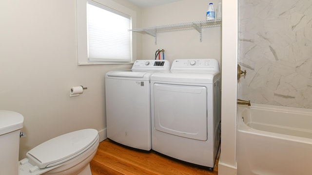 77 Smith St, Fryeburg, ME 04037 - full bathroom with separate washer and dryer, toilet, wood finished floors, and  shower combination