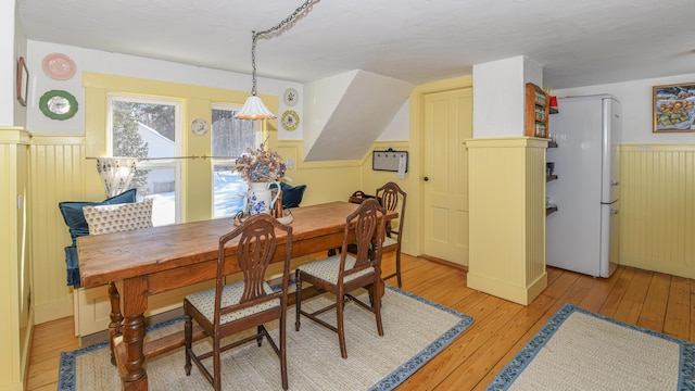 77 Smith St, Fryeburg, ME 04037 - dining space featuring a wainscoted wall and light wood-style flooring