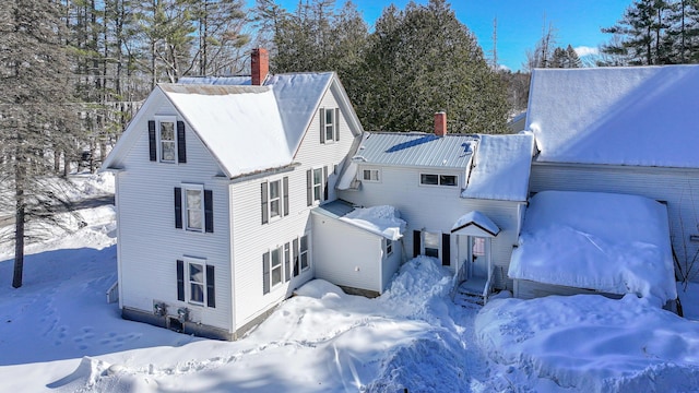 77 Smith St, Fryeburg, ME 04037 - snow covered property with a chimney