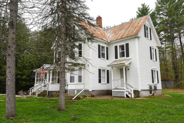 77 Smith St, Fryeburg, ME 04037 - view of front facade with a chimney, metal roof, and a front yard