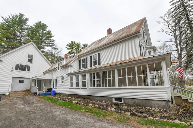 77 Smith St, Fryeburg, ME 04037 - rear view of property with a chimney and a sunroom