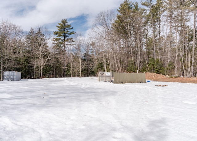 345 Songo Pond Rd, Bethel, ME 04217 - snowy yard featuring a wooded view