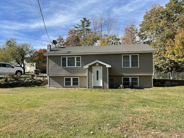 6 Alder Rd, Naples, ME 04055 - raised ranch featuring a front yard and a chimney