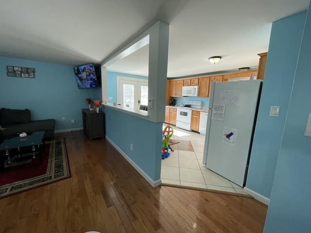 6 Alder Rd, Naples, ME 04055 - kitchen with white appliances, light wood-style flooring, and baseboards