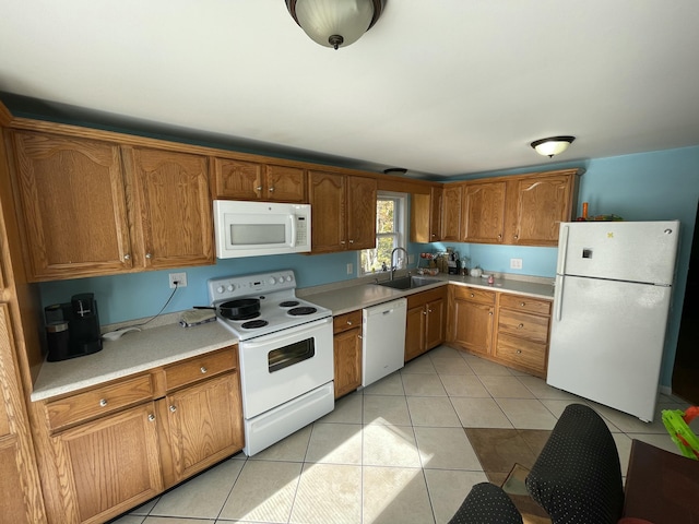 6 Alder Rd, Naples, ME 04055 - kitchen with white appliances, a sink, light tile patterned flooring, light countertops, and brown cabinetry